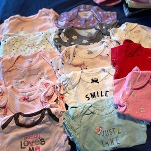 6-9 month short sleeve onesies newer condition